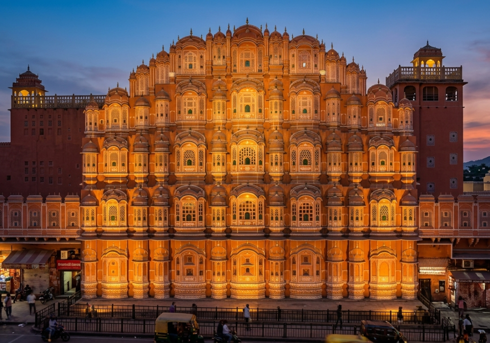Historic Hawa Mahal palace in Jaipur glowing at dusk